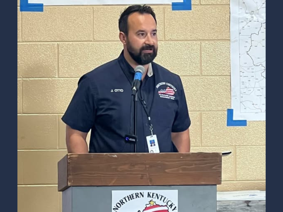 Justin Otto standing at a podium