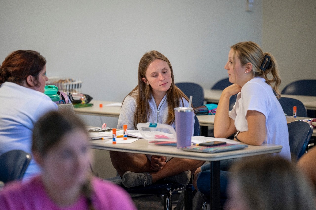 Two students studying together at a desk
